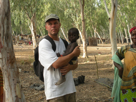 Holding a baby in Mali